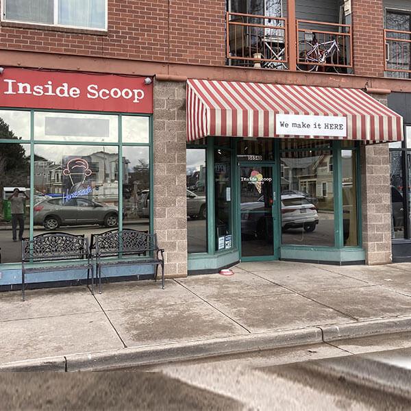 Inside Scoop Creamery storefront with its red striped awning in Historic Downtown Littleton